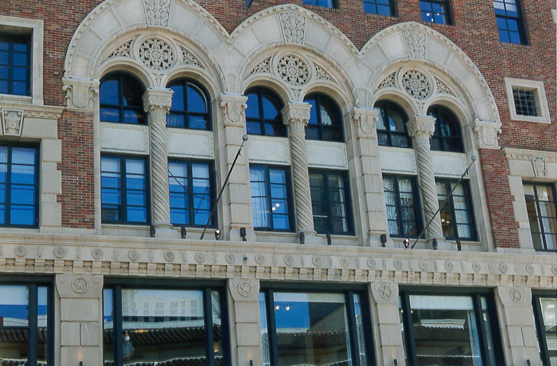 Rehabilitated windows, brick and terra cotta details, restored flag poles. 
